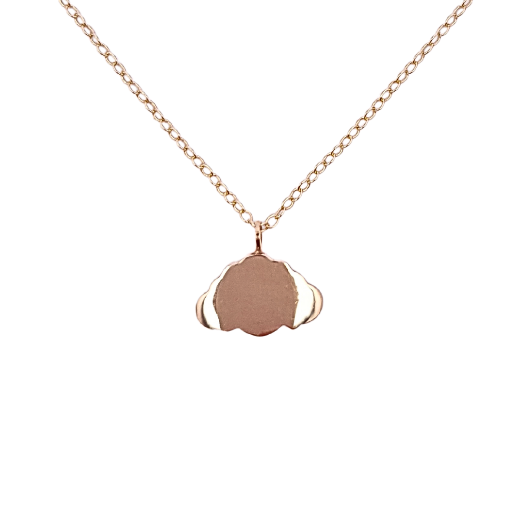 A 9ct gold chain necklace with a minimalist cloud-shaped charm hung on a dainty 9ct gold chain. Against a white background