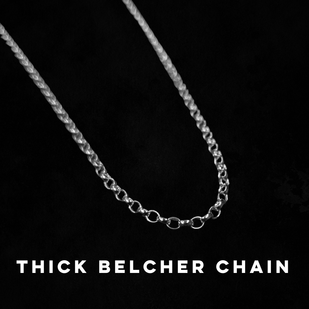 A thick belcher chain is laid on a black background.
White text, in all capitals, says "THICK BELCHER CHAIN".