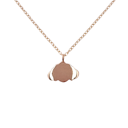 A 9ct gold chain necklace with a minimalist cloud-shaped charm hung on a dainty 9ct gold chain. Against a white background